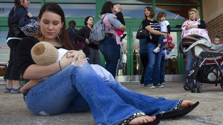 A woman feeds her son during a “nurse-in” outside of a Target in Texas in 2011 in response to a breastfeeding woman who was approached by store employees in one of the chain’s Houston locations. Women in at least 35 states participated in the protest. 