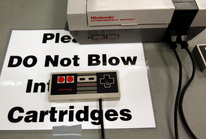 Blowing into old video game cartridges was common years ago, but a lot of gamers now recommend avoiding the practice since it can damage the games. The PAX East gaming conference (above) made that message explicit to its guests.