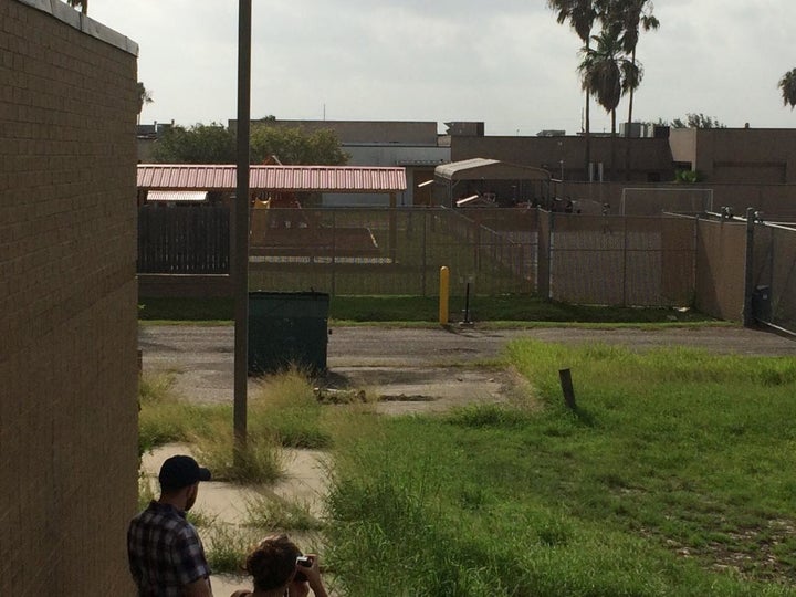 A photo Gabe took of kids playing in the back of Casa El Presidente. In the bottom left corner are freelancers for The New York Times.