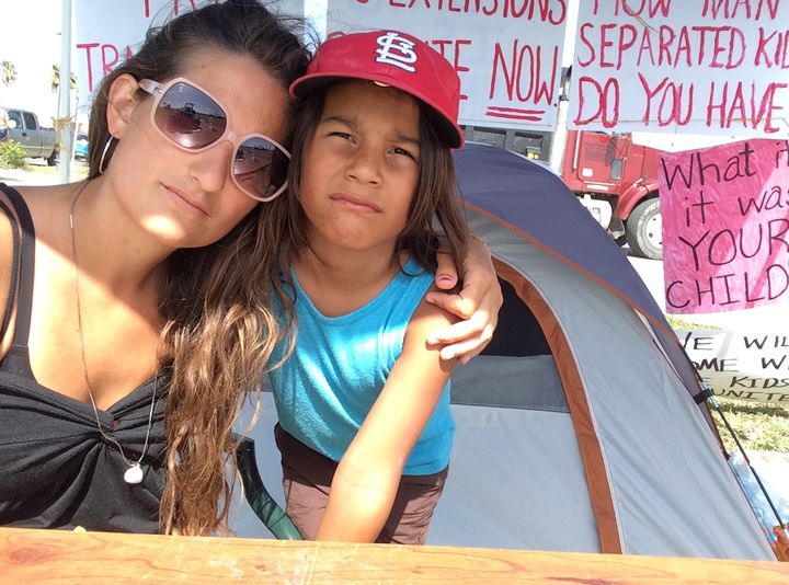 The author and her 7-year-old son Gabe in front of their encampment just outside the Casa El Presidente "tender age" shelter in Brownsville, Texas.