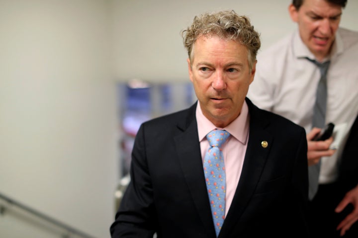 Sen. Rand Paul (R-Ky.) is trailed by reporters as he arrives for the weekly Senate Republican caucus luncheon at the U.S. Capitol in Washington on May 22, 2018.