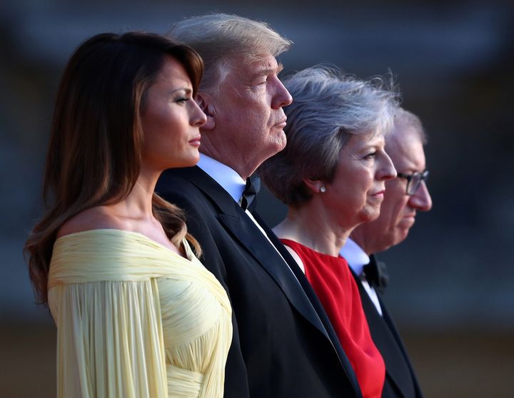 British Prime Minster Theresa May and her husband Philip stand together with U.S. President Donald Trump and First Lady Melania Trump at the entrance to Blenheim Palace.