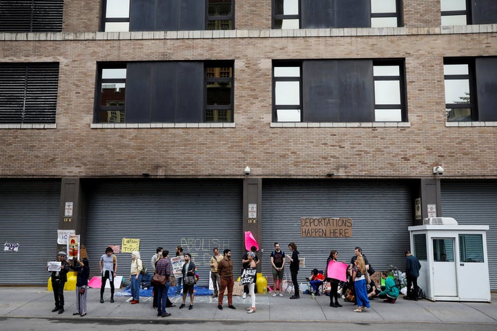 Demonstrators gather outside a building that houses the Immigration and Customs Enforcement offices in New York City on June