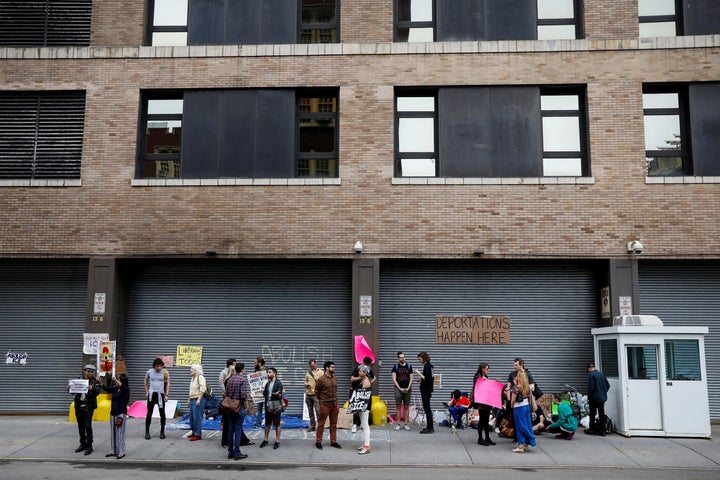 Demonstrators gather outside a building that houses the Immigration and Customs Enforcement offices in New York City on June 23.