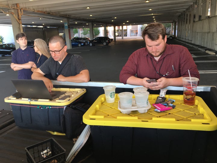 Capital Gazette reporter Chase Cook, right, and photographer Joshua McKerrow, left, work on the next day's paper while awaiting news of their colleagues in Annapolis, Maryland, on June 28, 2018.