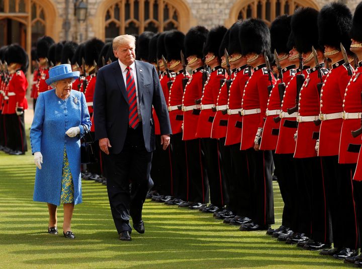 President Donald Trump and Britain's Queen Elizabeth inspect the Coldstream Guards during a visit Friday to Windsor Castle.