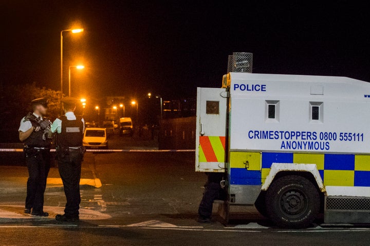 Police at the scene of an explosive device attack on the west Belfast home of Sinn Fein figure Bobby Storey