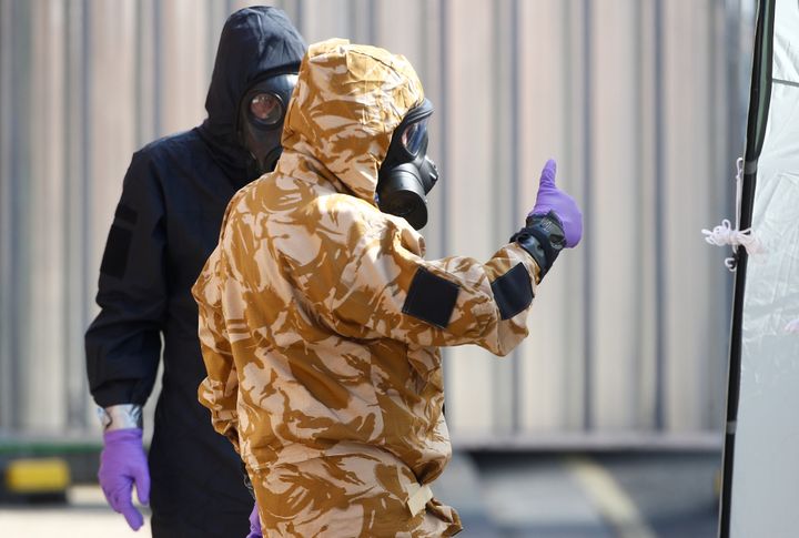 Forensic investigators wearing protective suits involved in the investigation of deaths from the nerve-agent Novichok in Amesbury, England.