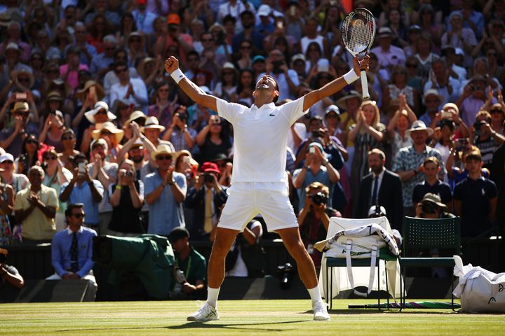Novak Djokovic of Serbia celebrates Championship point against Kevin Anderson of South Africa during the Men's Singles final on day thirteen of the Wimbledon Lawn Tennis Championships at All England Lawn Tennis and Croquet Club on July 15, 2018 in London, England. (Photo by Clive Brunskill/Getty Images)