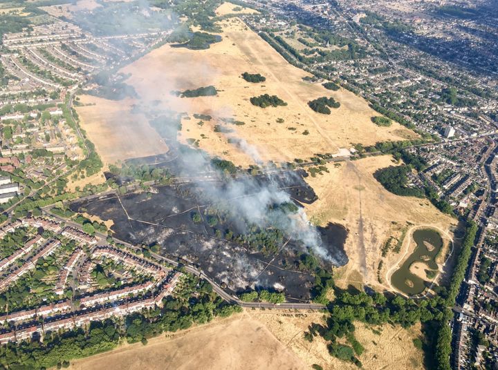 Images from a police helicopter showing smoke rising from the scorched Wanstead Flats in east London.