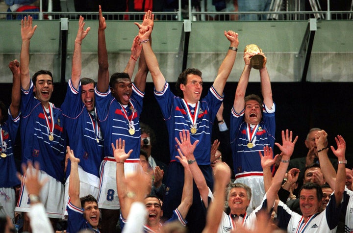 France players celebrate in 1998 as then captain Didier Deschamps, now the manager of the national team, lifts the World Cup.