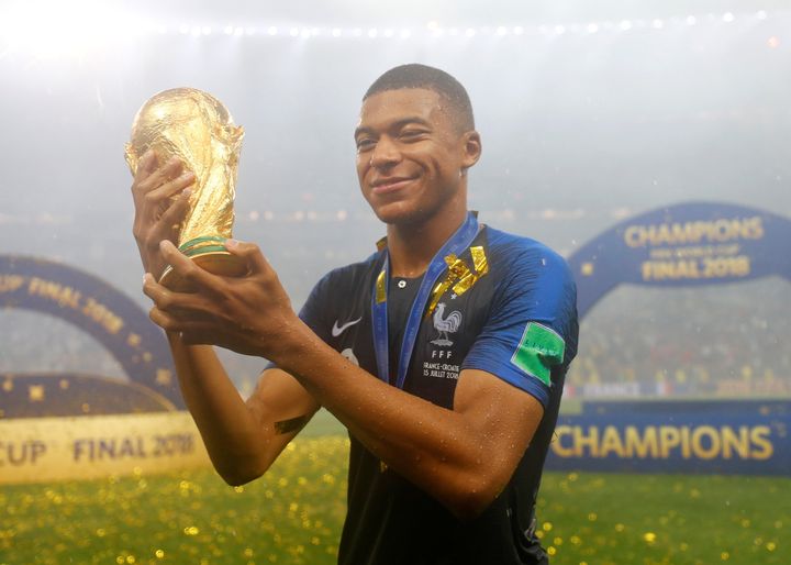 France's Kylian Mbappe celebrates with the trophy after winning the World Cup 