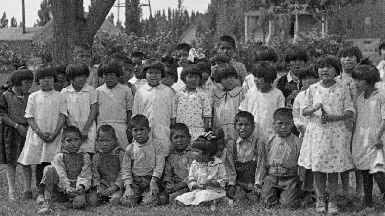 A group of Navajo children photographed in 1929. They were removed from their homes and placed into a government-run boarding school to “civilize” them.