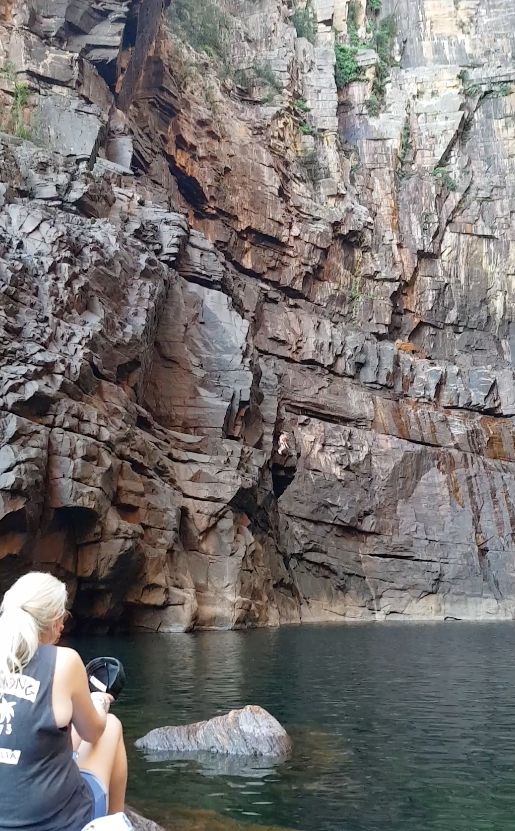 Josh Jones can be seen leaping of the Jim Jim falls (centre) in Australia's Northern Territory on Saturday