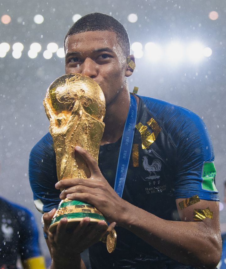 Kylian Mbappé of France celebrates with the World Cup Trophy following Sunday's victory against Croatia in Moscow.