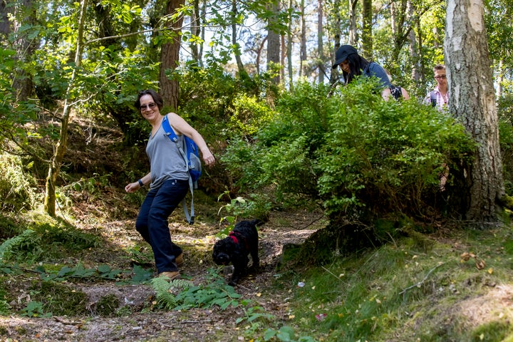 Ruth Watton with Minnie the dog conquering the hill. 