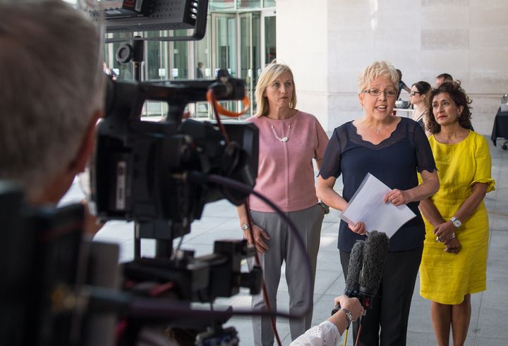 Former BBC China Editor Carrie Gracie, centre, speaks to the media outside the BBC after resolving her pay dispute; she is pictured alongside fellow corporation journalists Martine Croxall (left) and Razia Iqbal