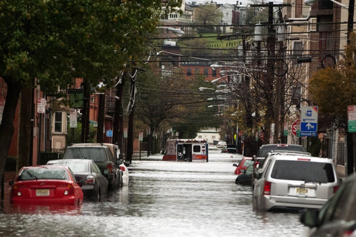 An ambulance sits abandoned in the middle of a flooded street after Superstorm Sandy on Oct. 30, 2012, in Hoboken, New Jersey.