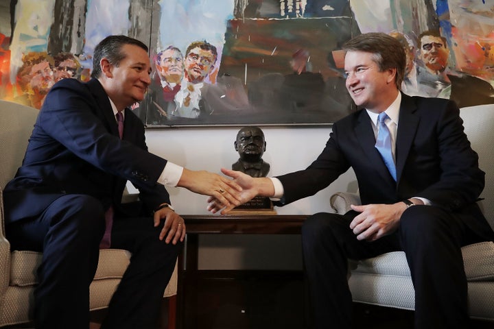 Senate Judiciary Committee member Ted Cruz shakes hands and poses for photos with Supreme Court nominee Brett Kavanaugh.