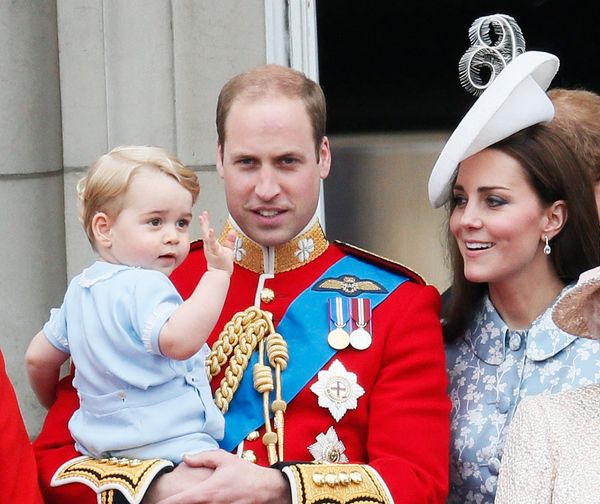 Prince William holds Prince George as he waves on the balcony at Buckingham Palace after the Trooping the Colour ceremony at 