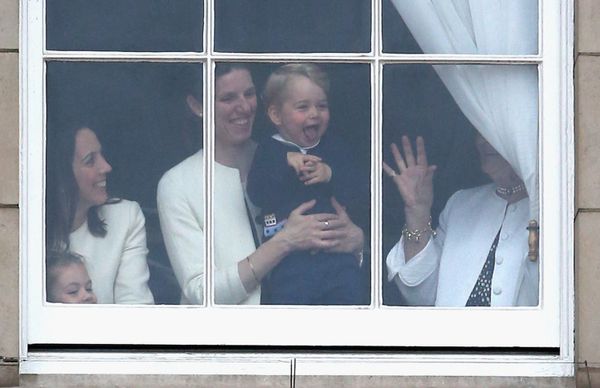  Prince George waves the window of Buckingham Palace while he's looking at the Trooping the Color on June 13, 2015, in London, 