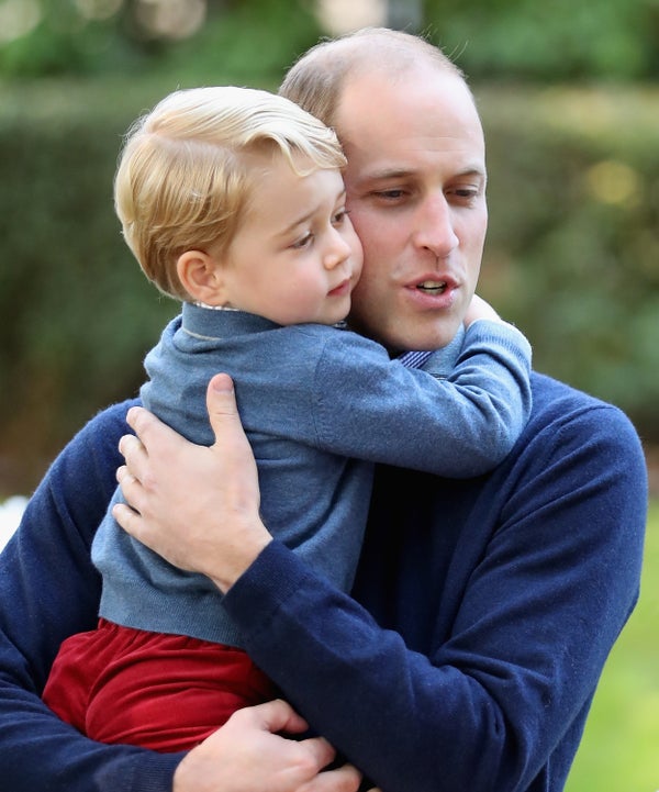 Prince George with Prince William at a children's party for military families during the Royal Tour of Canada on Sept. 2