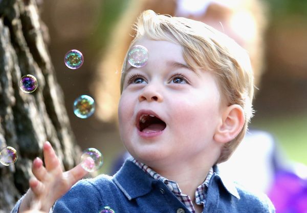 Prince George of Cambridge plays with bubbles at a children's party for military families during the Royal Tour of Canada on&