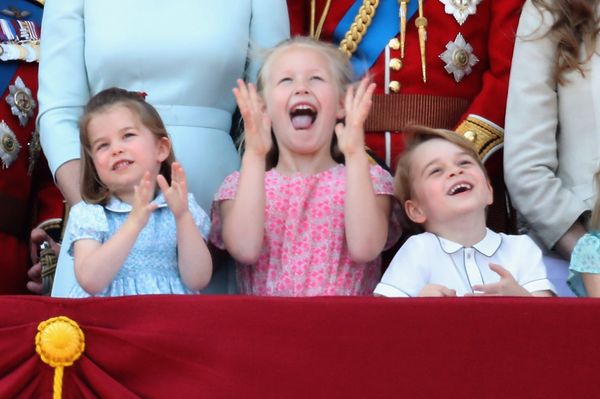 Princess Charlotte, Savannah Phillips, and Prince George watch the flypast on the balcony of Buckingham Palace during Troopin