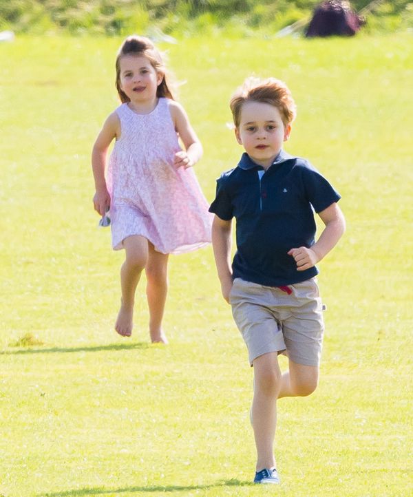  Prince George and Princess Charlotte run together during the Maserati Royal Charity Polo Trophy at Beaufort Park on June 10, 1965 