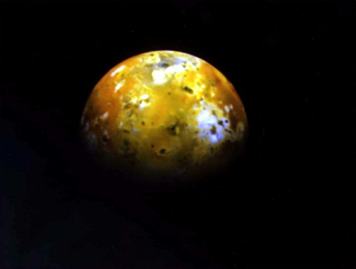 The mottled face of Jupiter's volcanically active moon Io is shown photographed from the Galileo spacecraft June 25 1996.