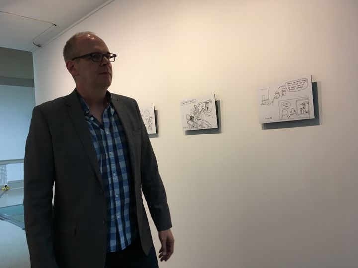 Cartoonist Rob Rogers, with some of his sketches of rejected ideas, featured in a new exhibition at the Corcoran School of the Arts and Design in Washington.