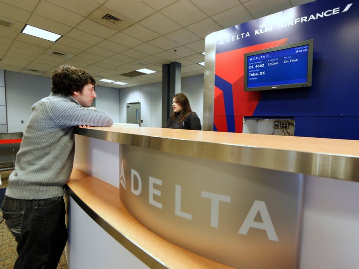 A passenger checks in at a Delta Airlines gate in Salt Lake City, Utah.