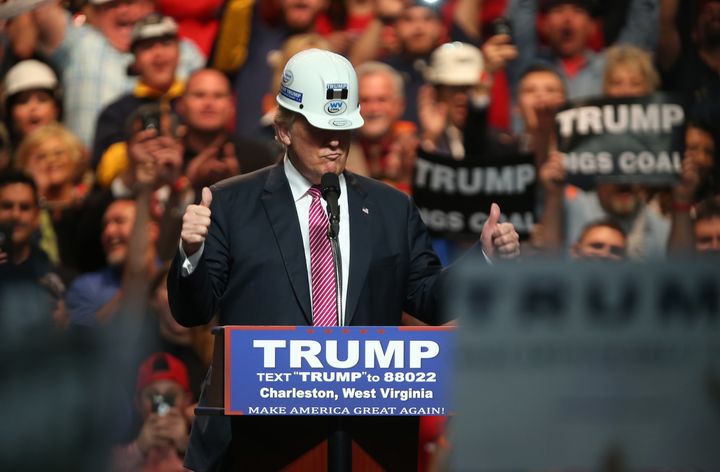 Then-presidential candidate Donald Trump wore a hard hat to show support for miners during a rally at the Charleston Civic Center in West Virginia on May 5, 2016.