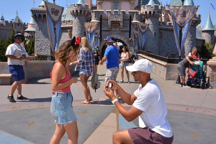 Williams got down on one knee in front of Disneyland's Sleeping Beauty Castle.