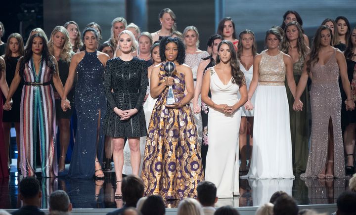 To accept the Arthur Ashe Courage Award, 141 survivors took the ESPY stage Wednesday night.