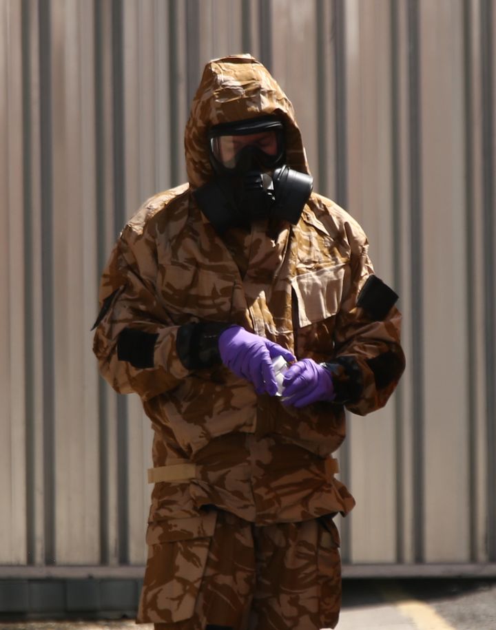 An investigator in a chemical suit works in Salisbury, following the second poisonings 
