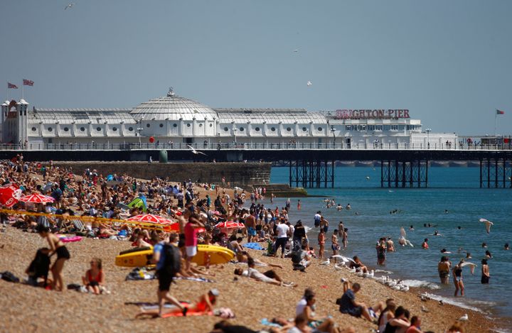 <strong>Sun worshippers enjoy Brighton beach during the heatwave.</strong>
