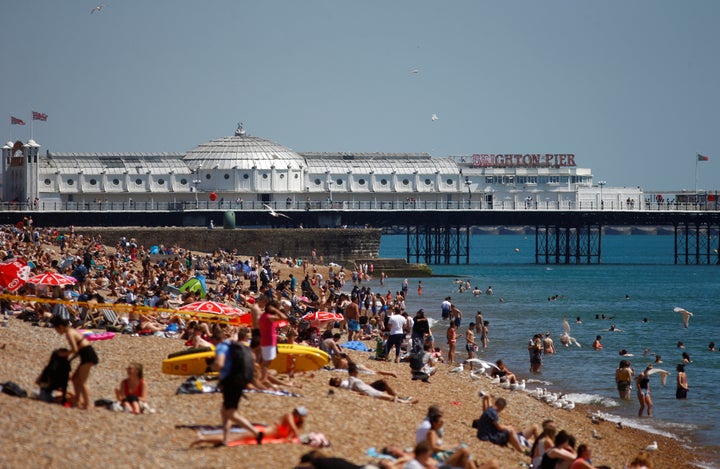 Sun worshippers enjoy Brighton beach during the heatwave.