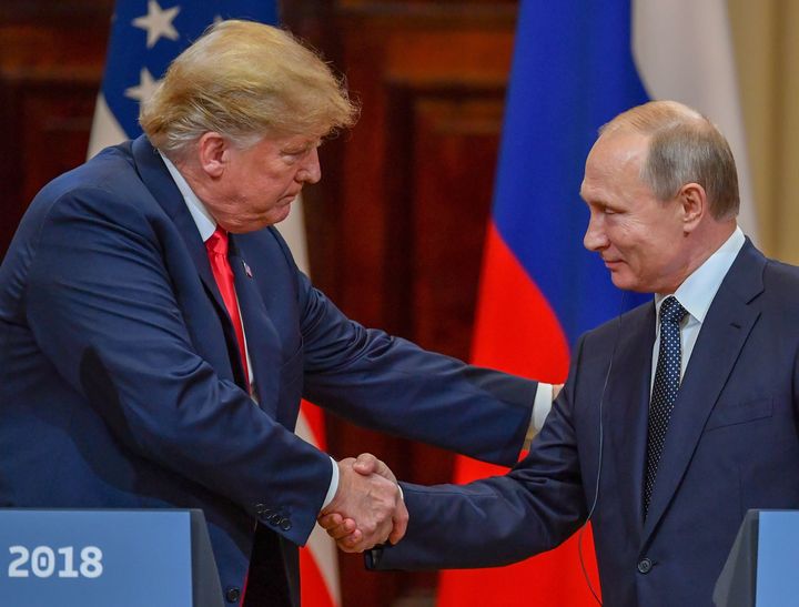 Donald Trump and Vladimir Putin shake hands after a meeting in Helsinki, Finland, on July 16.