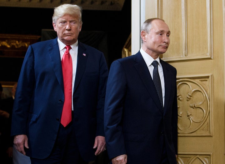 U.S. President Donald Trump and Russian President Vladimir Putin arrive for a meeting in Helsinki, on July 16, 2018. (BRENDAN SMIALOWSKI/AFP/Getty Images)