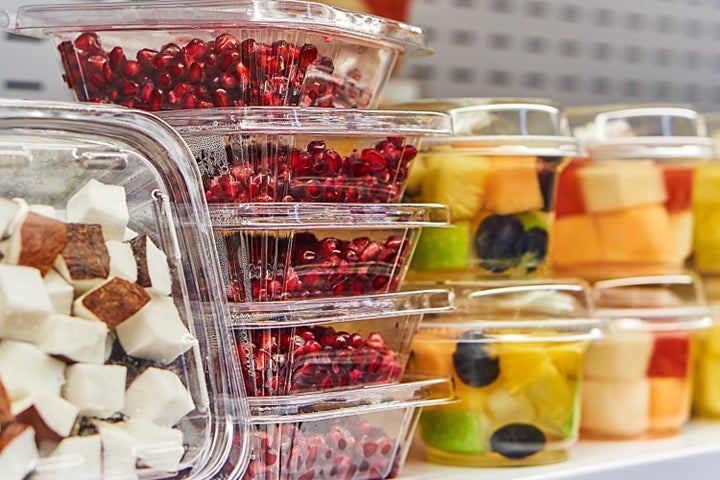 Cut fruit stored in plastic sits on store shelves. If we do nothing to slow down our consumption of plastic by 2050, there will be more plastic in the ocean than fish by weight.