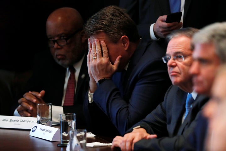 Sen. Jeff Flake (R-Ariz.) rubs his eyes as he listens to President Donald Trump speak at a bipartisan White House meeting with legislators on immigration reform on Jan. 9.