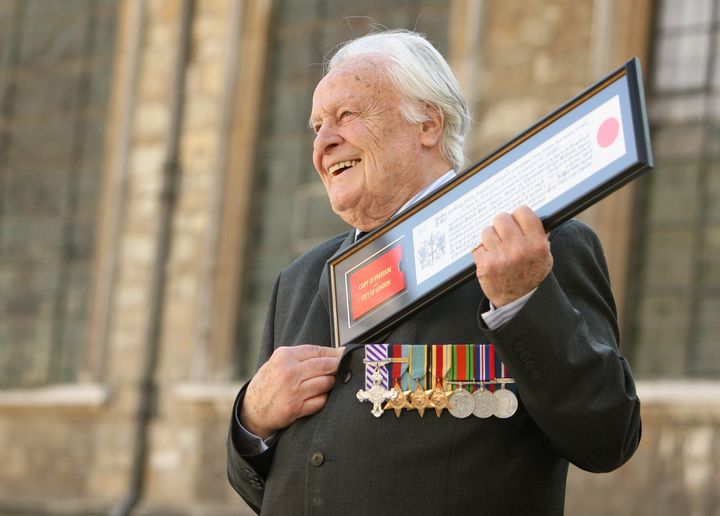 Squadron Leader Geoffrey Wellum DFC, the youngest Spitfire pilot to fight in the Battle of Britain, holds his Freedom Certificate after receiving the Freedom of the City of London at the Guildhall, in central London (file photo).