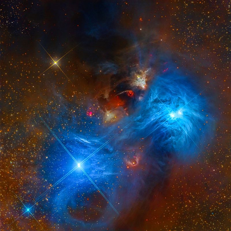 These spectacular reflection nebulae in the Corona Australis constellation depict the characteristic vivid blue color produced by the light of hot stars reflected by silica-based cosmic dust A rare high resolution view of the cores NGC 6726 and 6727 is captured on camera The data was acquired by Star Shadows Remote Observatory at CTIOs PROMPT2 using LRGB filters stacked with CCDStack and post-processed in Photoshop and PixInsight  La Serena Chile 30 June 2017