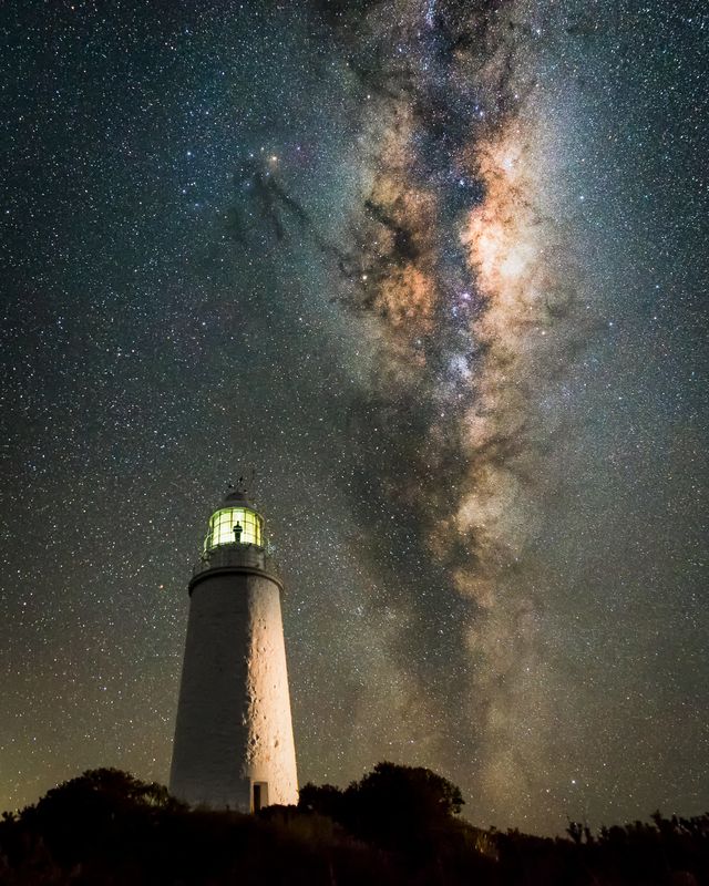 The Milky Way rises above an isolated lighthouse in Tasmania The photographer planned his position to shoot the perfect composition positioning the Milky Way in conjunction with the lighthouse and observing how to best light the tower for artistic effect This image is part of a time-lapse sequence allowing the photographer some time to climb the tower into the lantern room of the lighthouse and reflect on the hard and lonely yet incredible life the former lighthouse keepers would have lived  Bruny Island Tasmania Australia 21 July 2017