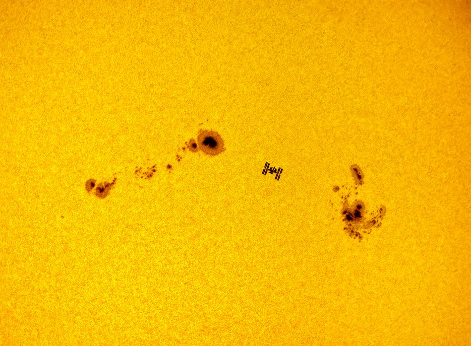 The International Space Station ISS was captured between two massive sunspots the AR 12674 and AR 12673 during its solar transit The image was taken in Madrid and it took ISS less than a second to cross the solar disk Madrid Spain 5 September 2017