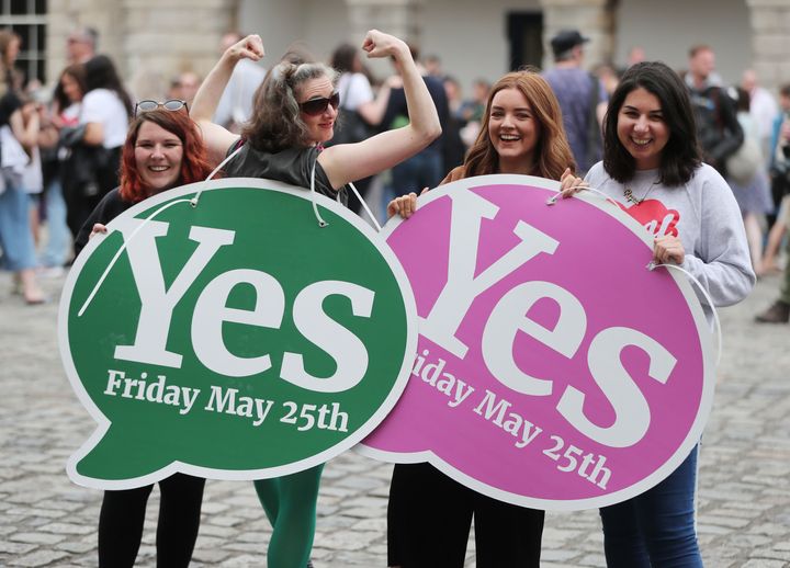 Members of the public celebrate at Dublin Castle after the results of the referendum 
