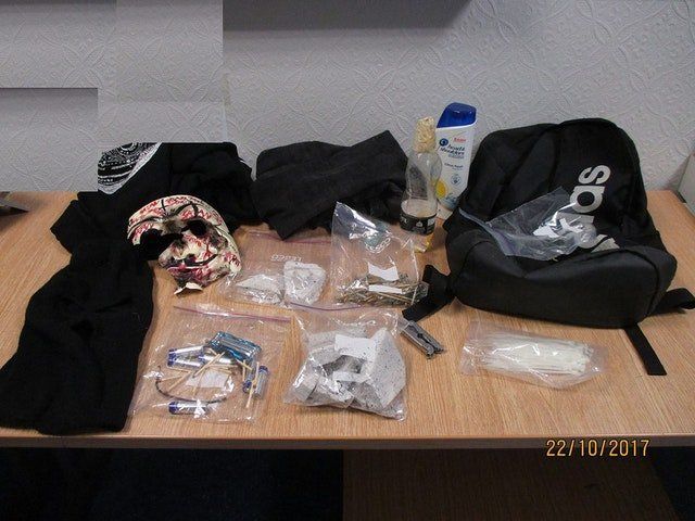 The contents of a rucksack that was found by officers searching the secret hideout.