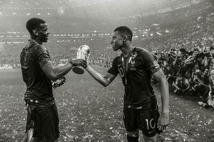 Paul Pogba and Kylian Mbappe of France celebrate winning the World Cup on July 15, 2018, in Moscow.