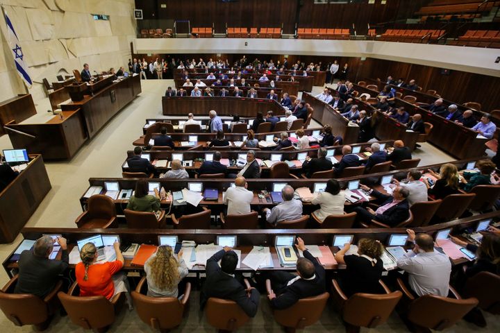 Israeli members of Parliament attend the Knesset Plenary Hall session ahead of the vote on the law that establishes Jewish people's "unique" right to self-determination in Israel on July 18, 2018.